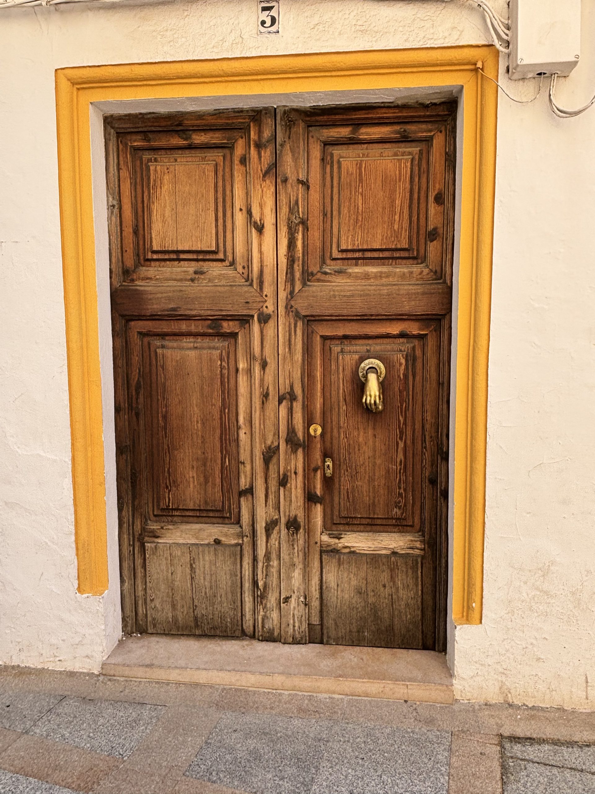 hand and ball door knocker in Xàbia's Old Town